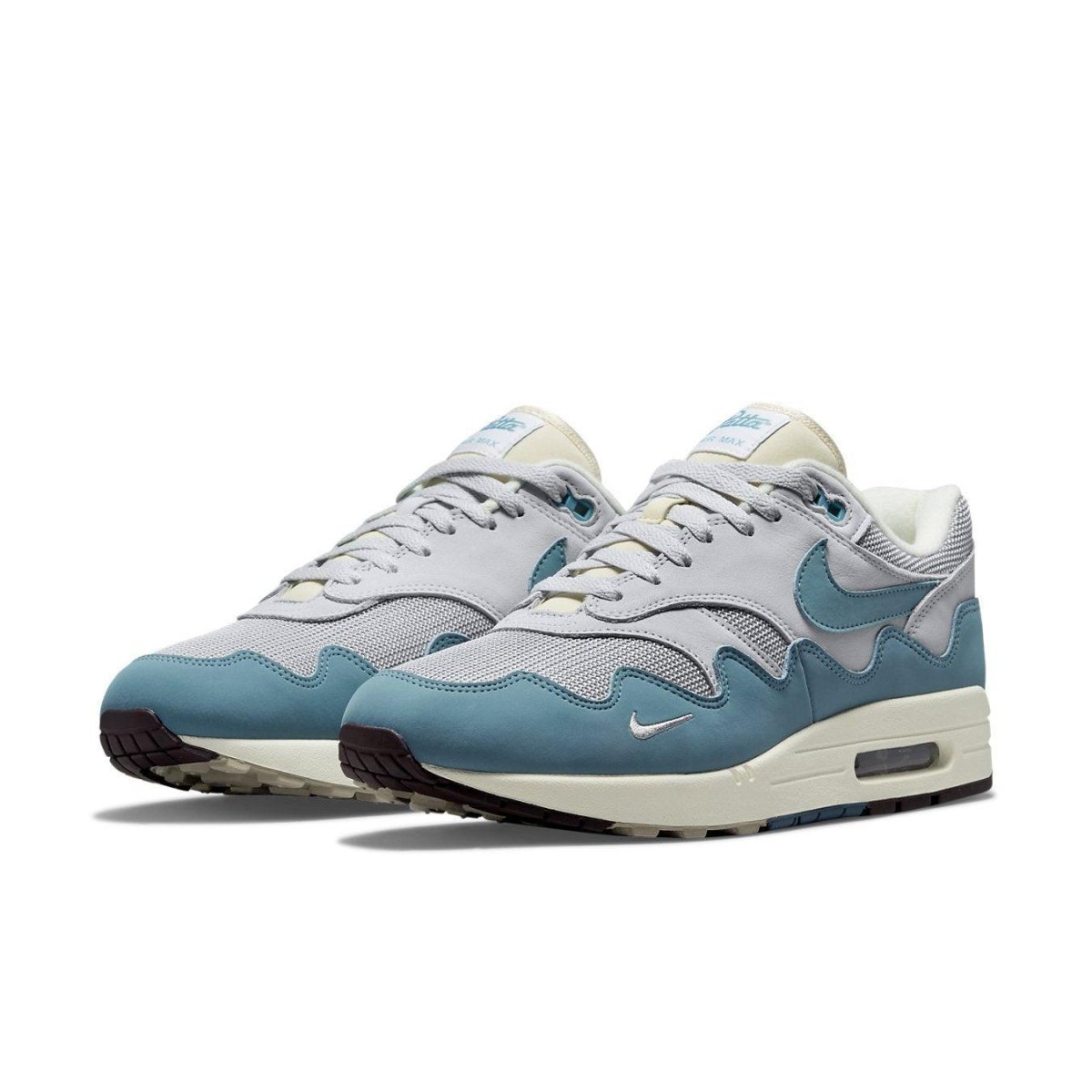 Nike Air Max 1 Patta Noise Aqua in gray mesh and blue suede, featuring ocean wave design and iconic Swoosh.