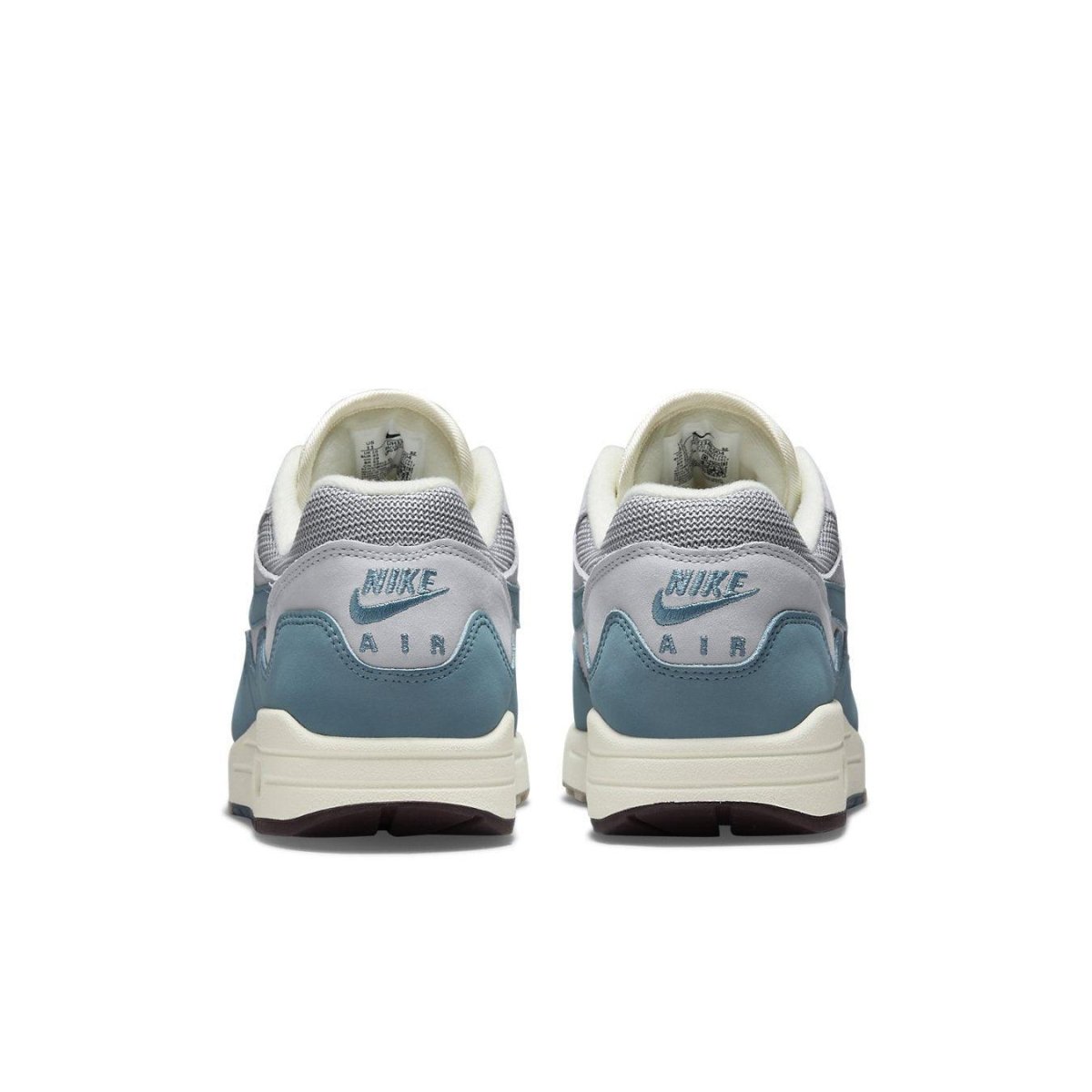 Rear view of Nike Air Max 1 Patta Waves Noise Aqua, featuring gray mesh and blue suede details.