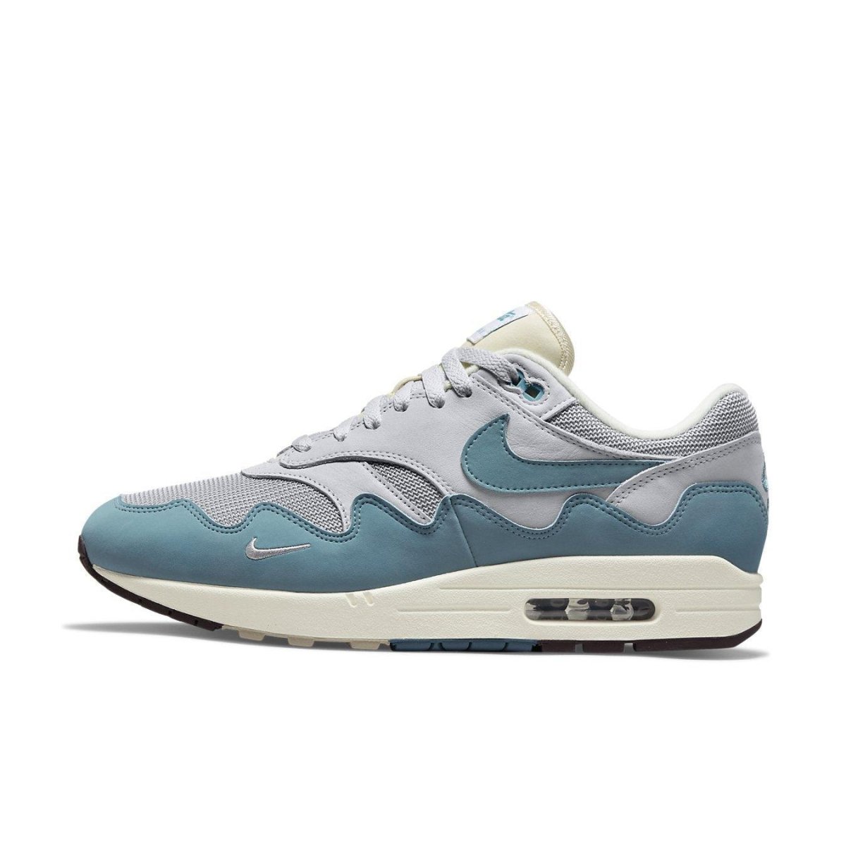 Nike Air Max 1 Patta Waves Noise Aqua in grey mesh and blue suede, featuring iconic Swoosh design and Patta logo.