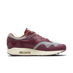 Nike Air Max 1 Patta Waves in Rush Maroon with grey mesh, smooth brown leather, and wave-shaped overlays.