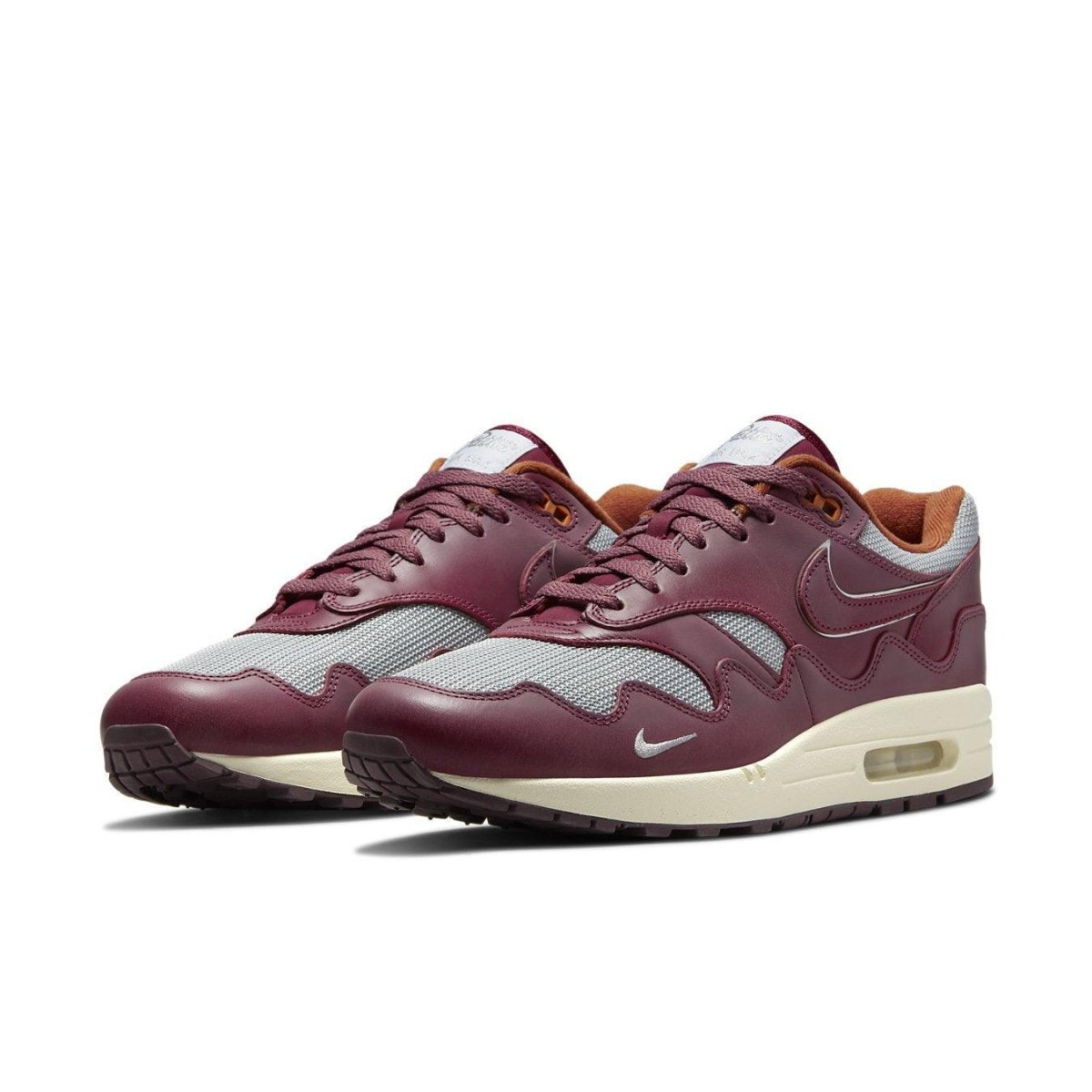 Nike Air Max 1 Patta Waves Rush Maroon sneaker featuring gray mesh and smooth brown leather overlays.
