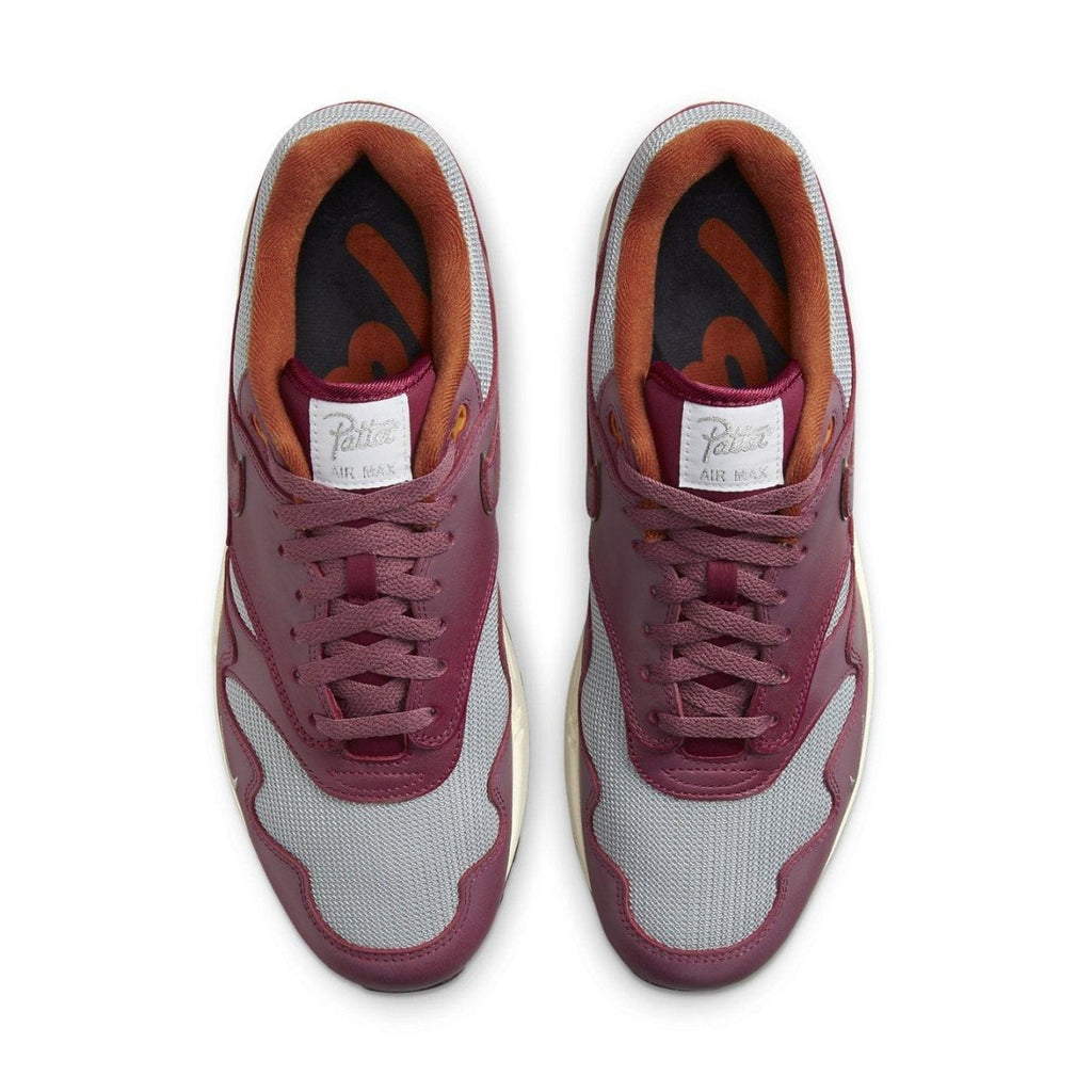 Nike Air Max 1 Patta Waves Rush Maroon top view with grey mesh and smooth brown leather details.