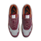 Nike Air Max 1 Patta Waves Rush Maroon top view with grey mesh and smooth brown leather details.