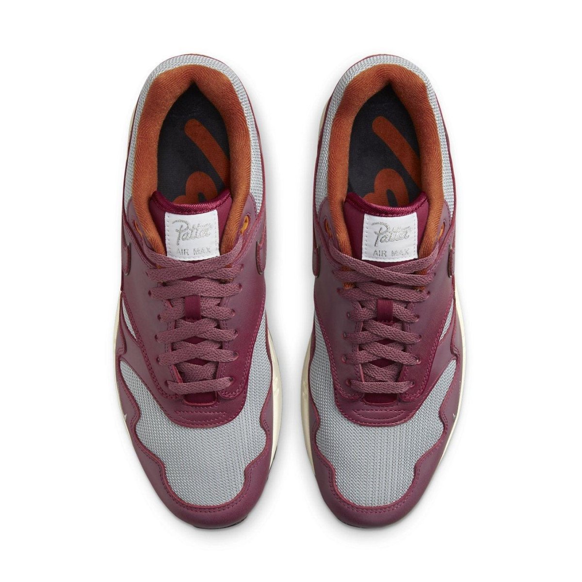 Nike Air Max 1 Patta Waves Rush Maroon top view with grey mesh and smooth brown leather details.