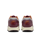 Nike Air Max 1 Patta Waves in Rush Maroon, featuring a grey mesh upper and smooth brown leather accents.