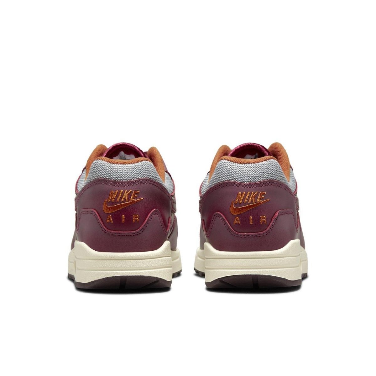 Nike Air Max 1 Patta Waves in Rush Maroon, featuring a grey mesh upper and smooth brown leather accents.