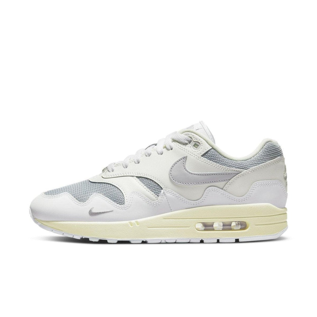 Nike Air Max 1 Patta Waves in metallic silver with grey accents, showcasing sleek design and comfort.