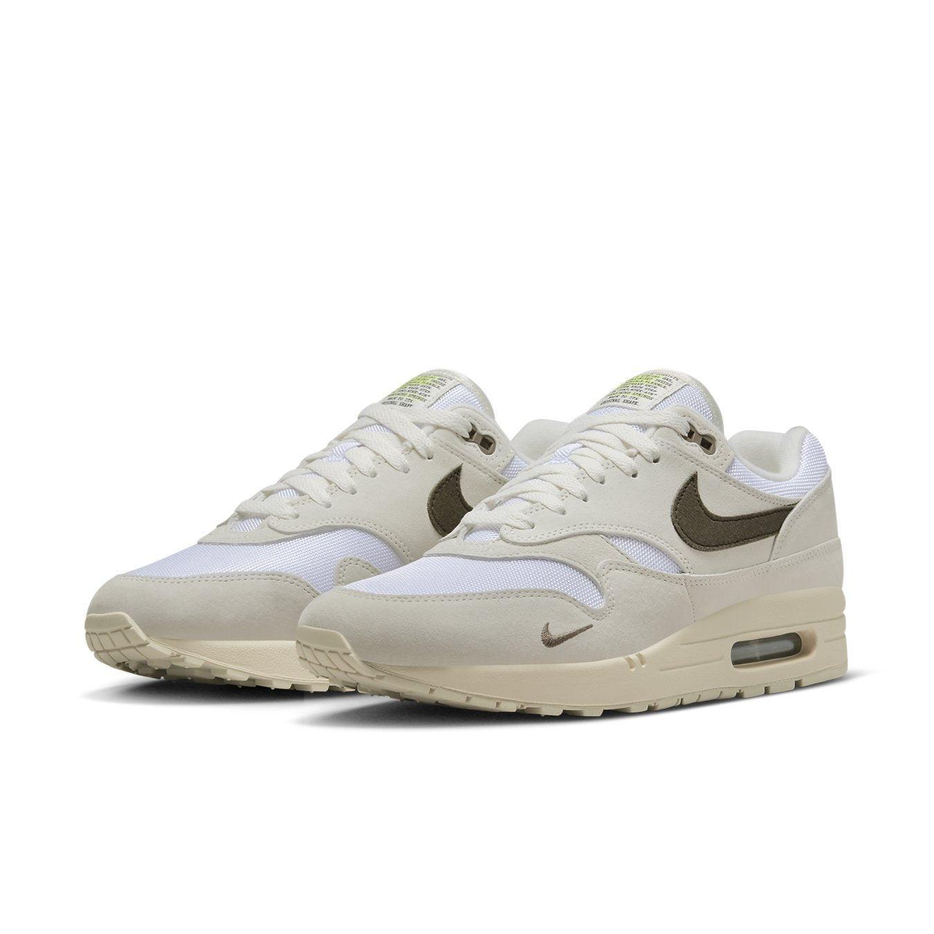 Nike Air Max 1 Sail Ironstone sneakers featuring a cream mesh upper and brown accents, combining comfort with style.