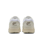 Nike Air Max 1 Sail Ironstone sneakers, rear view showcasing premium materials and classic branding.