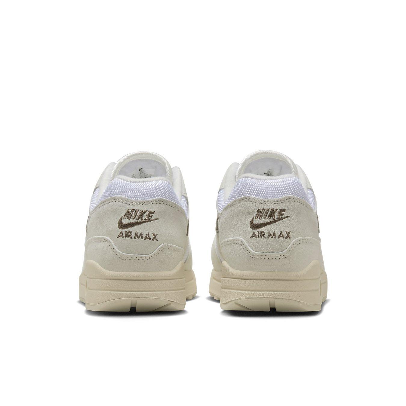 Nike Air Max 1 Sail Ironstone sneakers, rear view showcasing premium materials and classic branding.