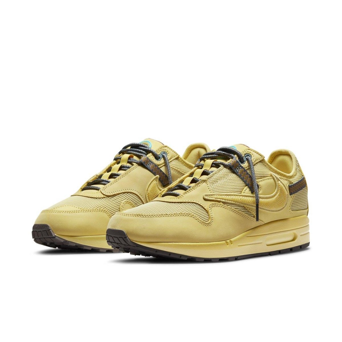 Nike Air Max 1 Travis Scott Cactus Jack Saturn Gold sneakers in yellow with breathable mesh and leather.