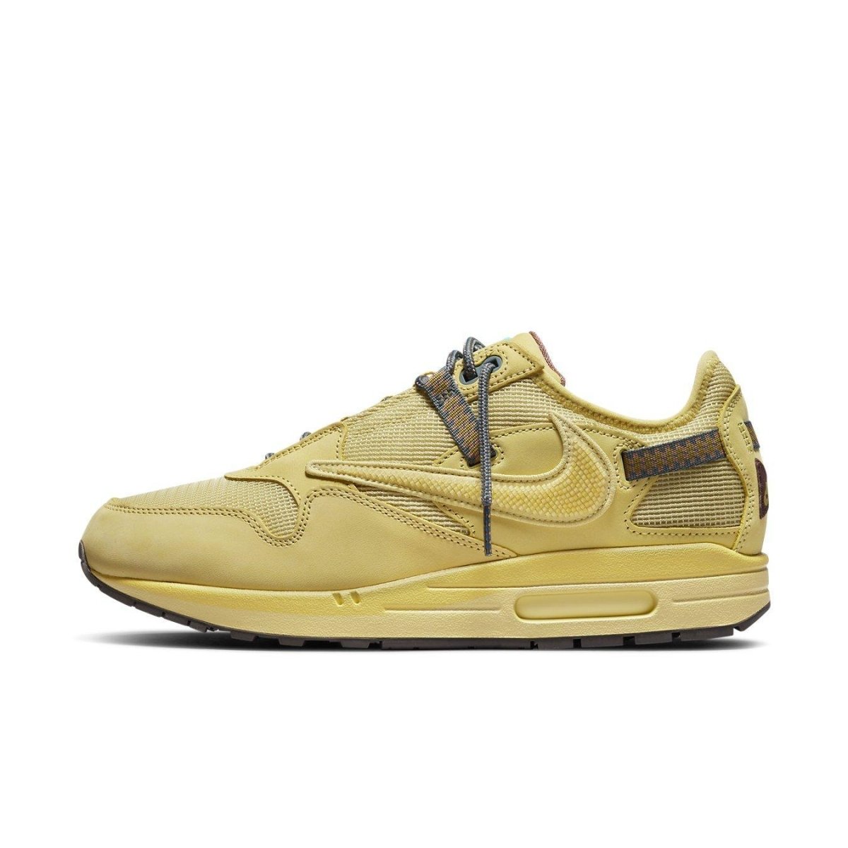 Nike Air Max 1 Travis Scott Cactus Jack Saturn Gold sneaker in yellow with mesh and leather detailing.