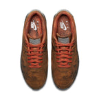 Nike Air Max 90 Mars Landing sneakers in Mars Stone and Magma Orange from top view, featuring unique textural design.