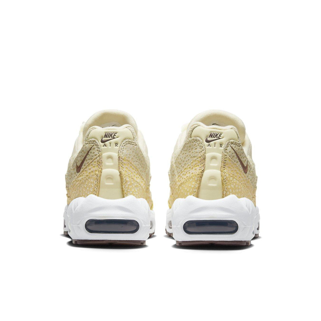 Nike Air Max 95 Saturn Gold Alabaster women's sneakers, back view showcasing gold and white design.