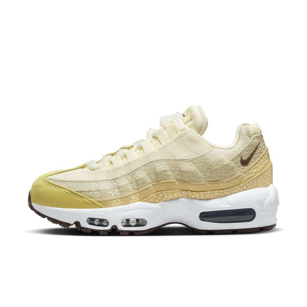 Nike Air Max 95 Saturn Gold Alabaster women's sneaker in yellow and white, featuring Air cushioning for comfort and style.