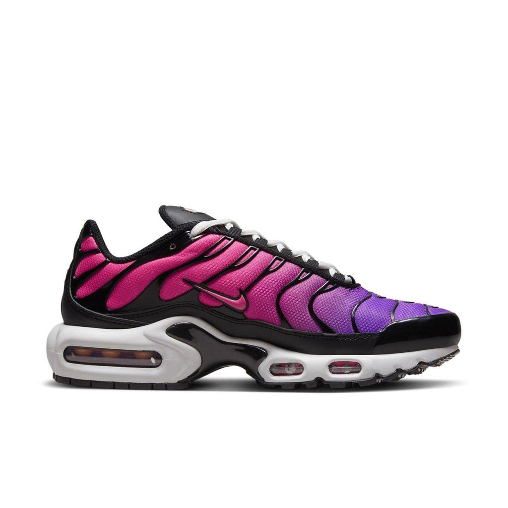 Nike Air Max Plus Dusk Women's sneakers featuring a gradient purple to pink upper with black and white accents.