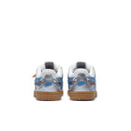 Nike Air Rubber Dunk Off-White University Blue PS sneakers, showing the rear view with mesh and silver overlays.
