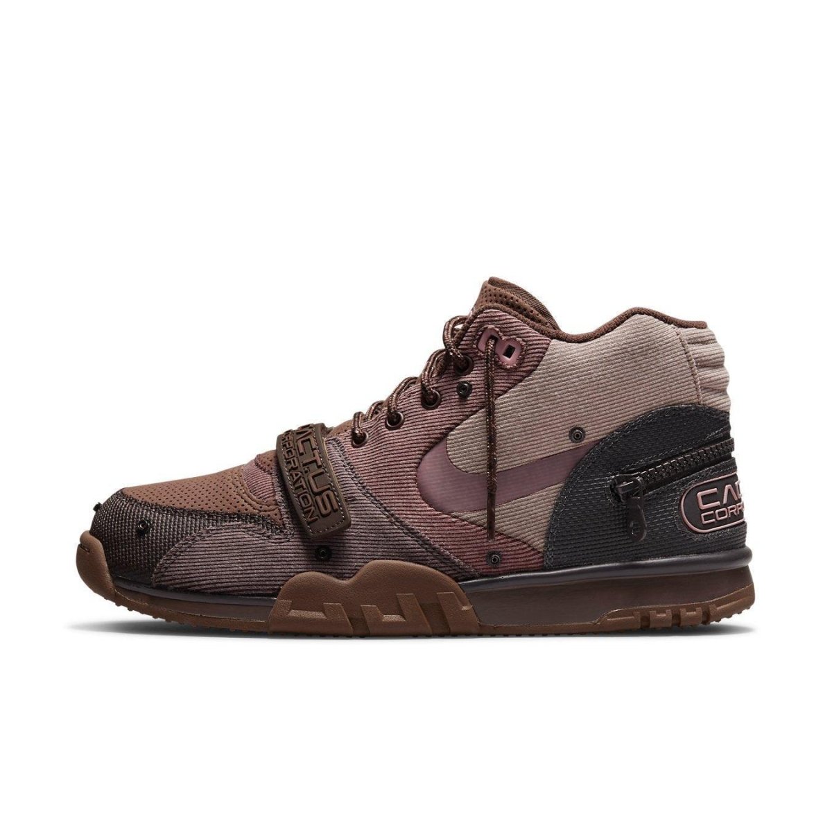 Nike Air Trainer 1 SP Travis Scott Wheat sneaker in brown and beige with Swoosh logo and adjustable strap.