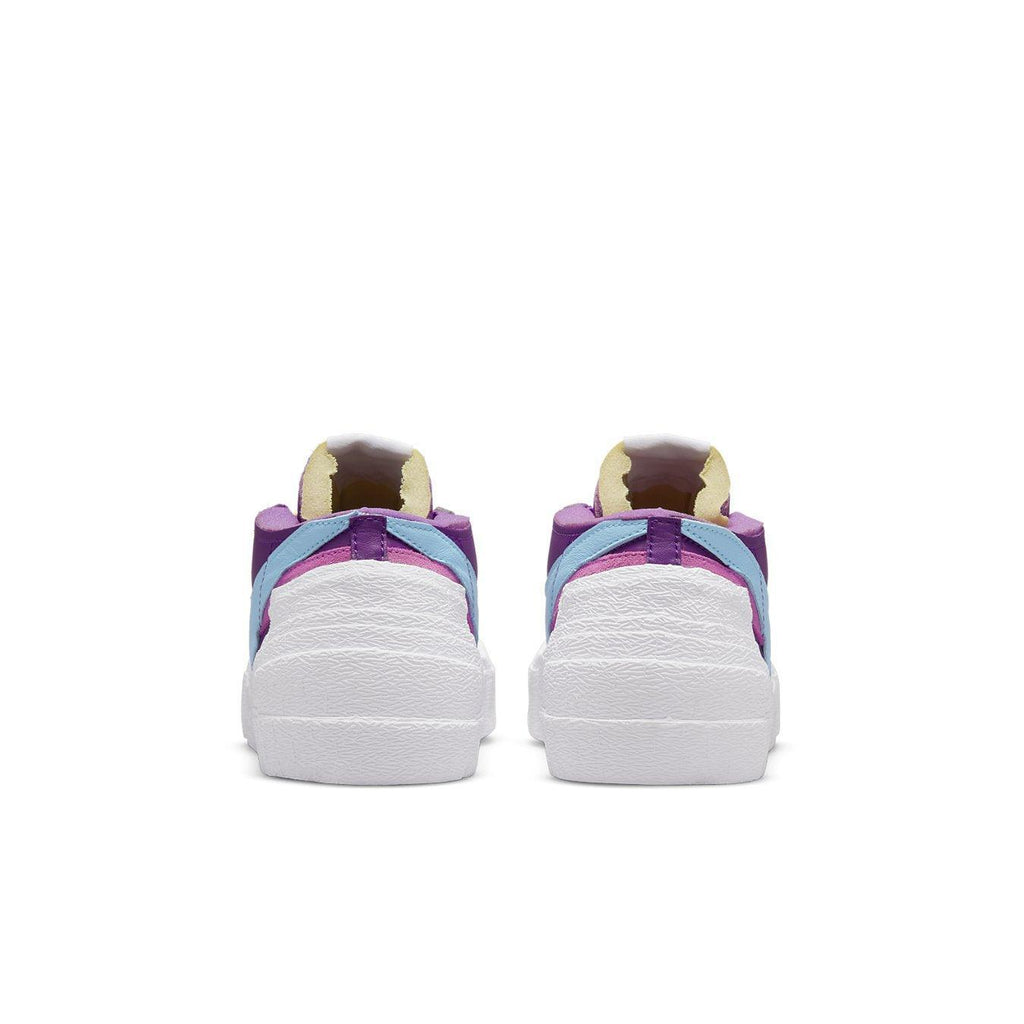 Nike Blazer Low sacai KAWS in Purple Dusk, featuring unique color design and stylish silhouette from the back view.