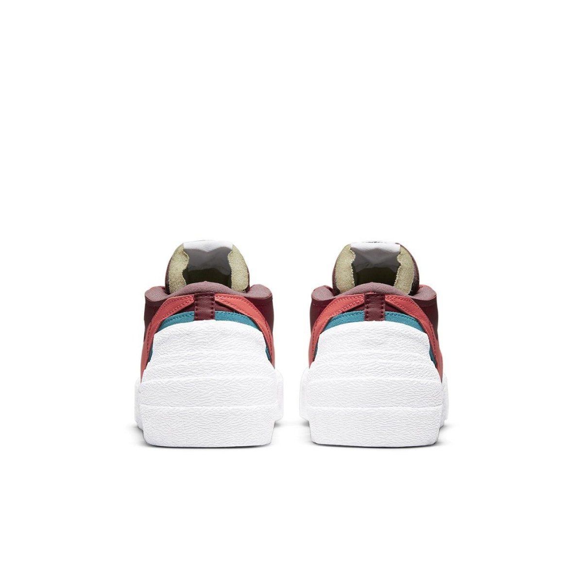 Back view of Nike Blazer Low sacai KAWS Red sneakers featuring dark red leather and contrasting color detailing.