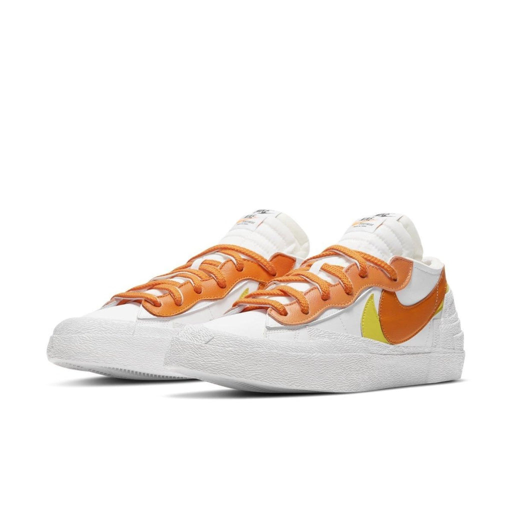 Nike Blazer Low sacai in White and Magma Orange featuring double laces and layered design.