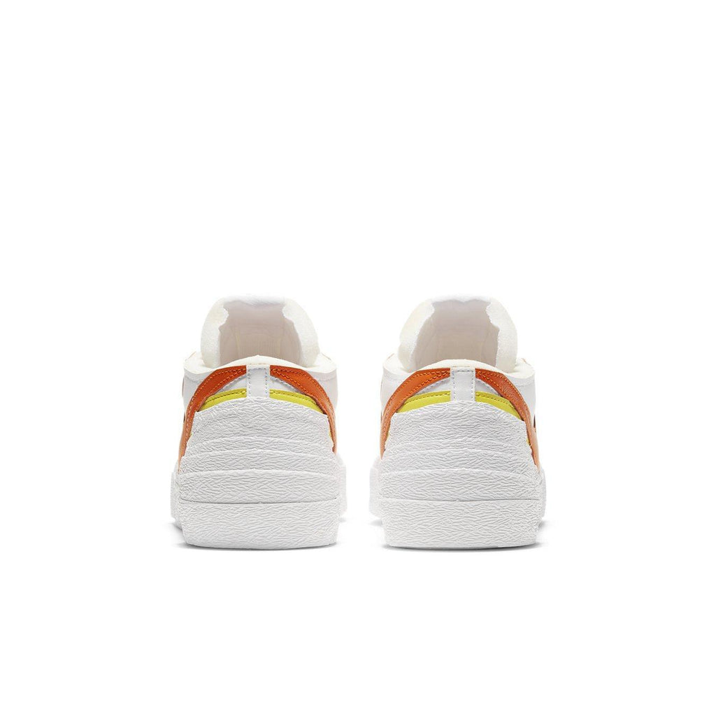 Nike Blazer Low sacai White Magma Orange rear view showcasing the distinctive overlapping Swoosh design.