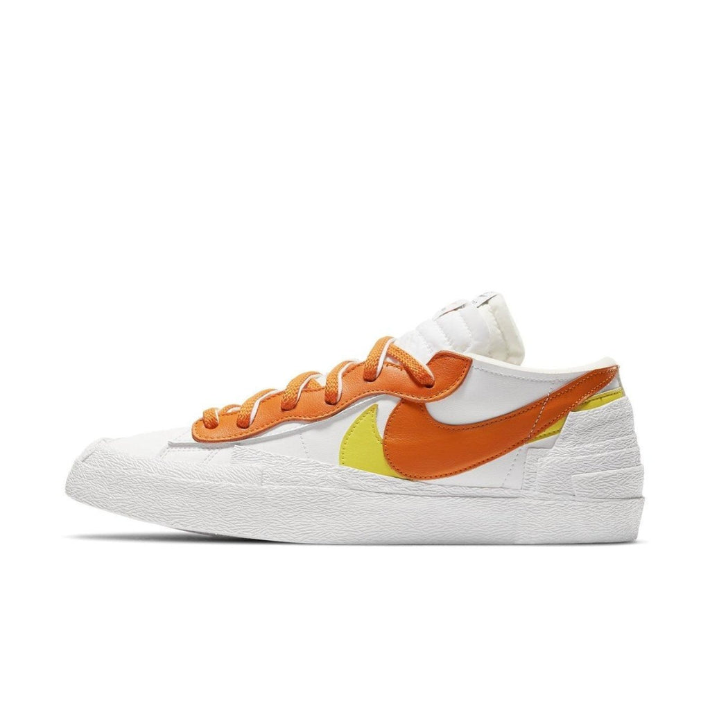 Nike Blazer Low sacai White Magma Orange sneakers with orange and yellow accents, featuring double laces and layered design elements.