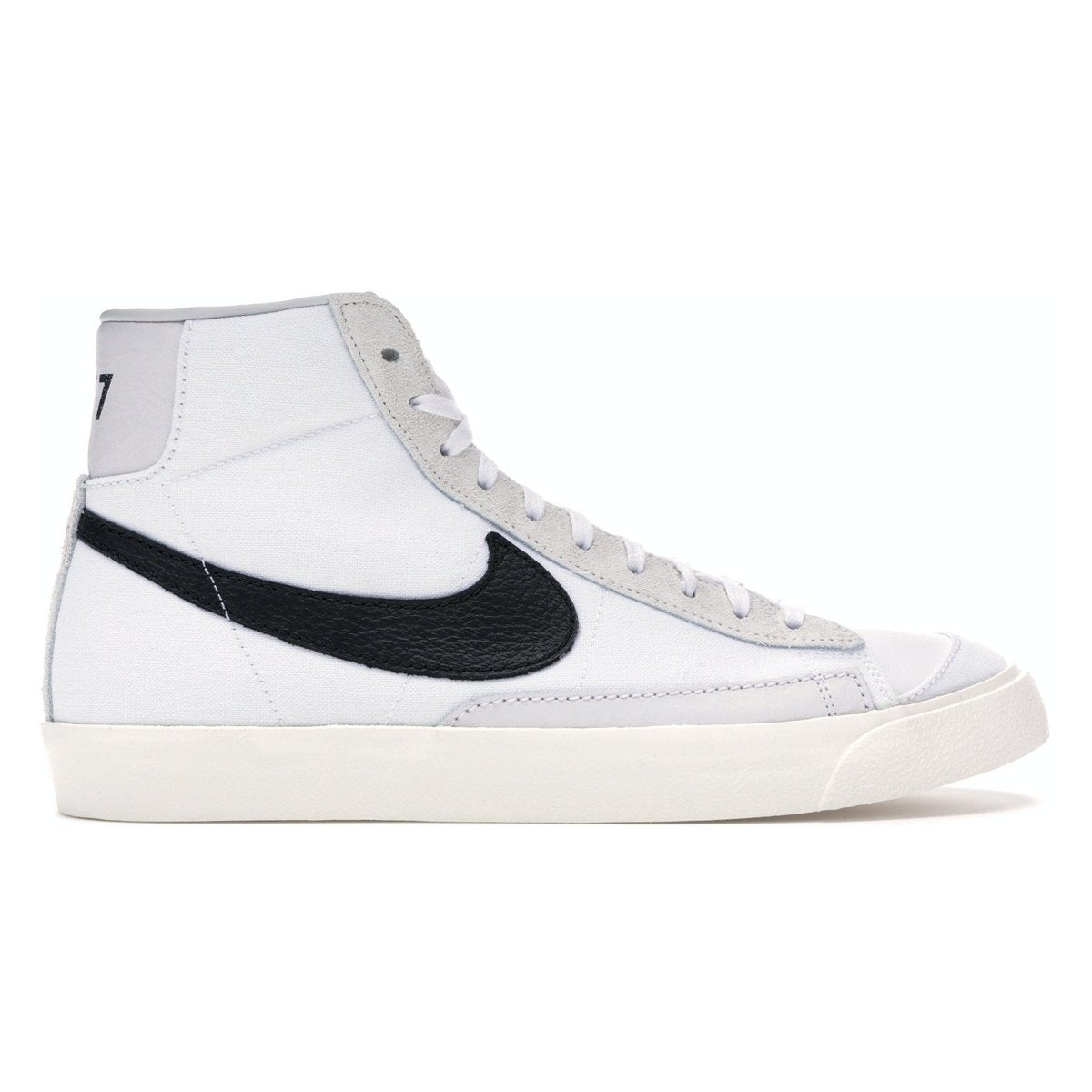 Nike Blazer Mid 77 Vintage Slam Jam sneakers in white and black side view.