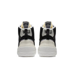 Nike Blazer Mid sacai Black Grey sneaker rear view showcasing stylish design and color contrast.