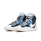 Nike Blazer Mid sacai Legend Blue sneakers featuring black and blue colorway with distinctive Sacai design.