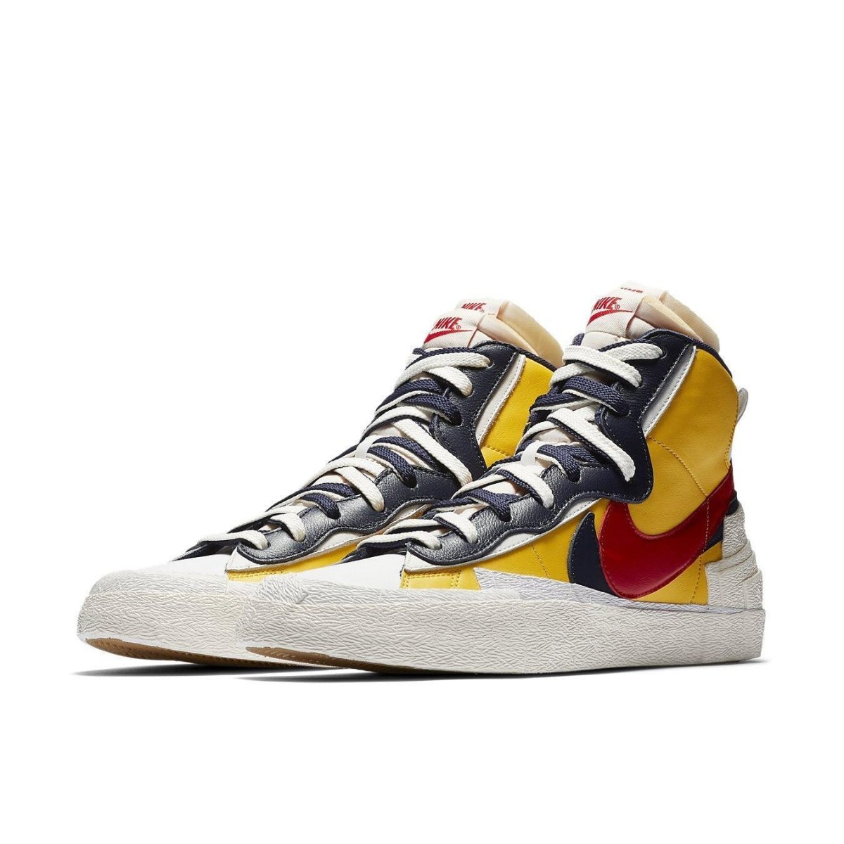Nike Blazer Mid sacai Snow Beach sneaker featuring yellow, navy, and red colorway with double laces and eyelets.