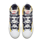 Nike Blazer Mid sacai Snow Beach sneakers in navy and maize colorway, featuring double tongues and laces.