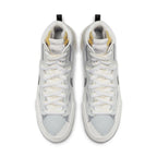 Nike Blazer Mid sacai in white and grey, featuring double Swoosh design and unique lace-up style from above.