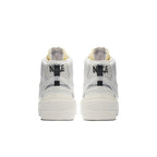 Back view of Nike Blazer Mid sacai White Grey sneakers showcasing two Swoosh designs and stylish high-top silhouette.