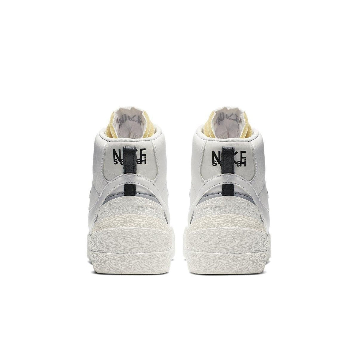 Back view of Nike Blazer Mid sacai White Grey sneakers showcasing two Swoosh designs and stylish high-top silhouette.