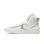 Nike Blazer Mid sacai in white and grey, featuring double Swoosh design for a stylish sneaker look.