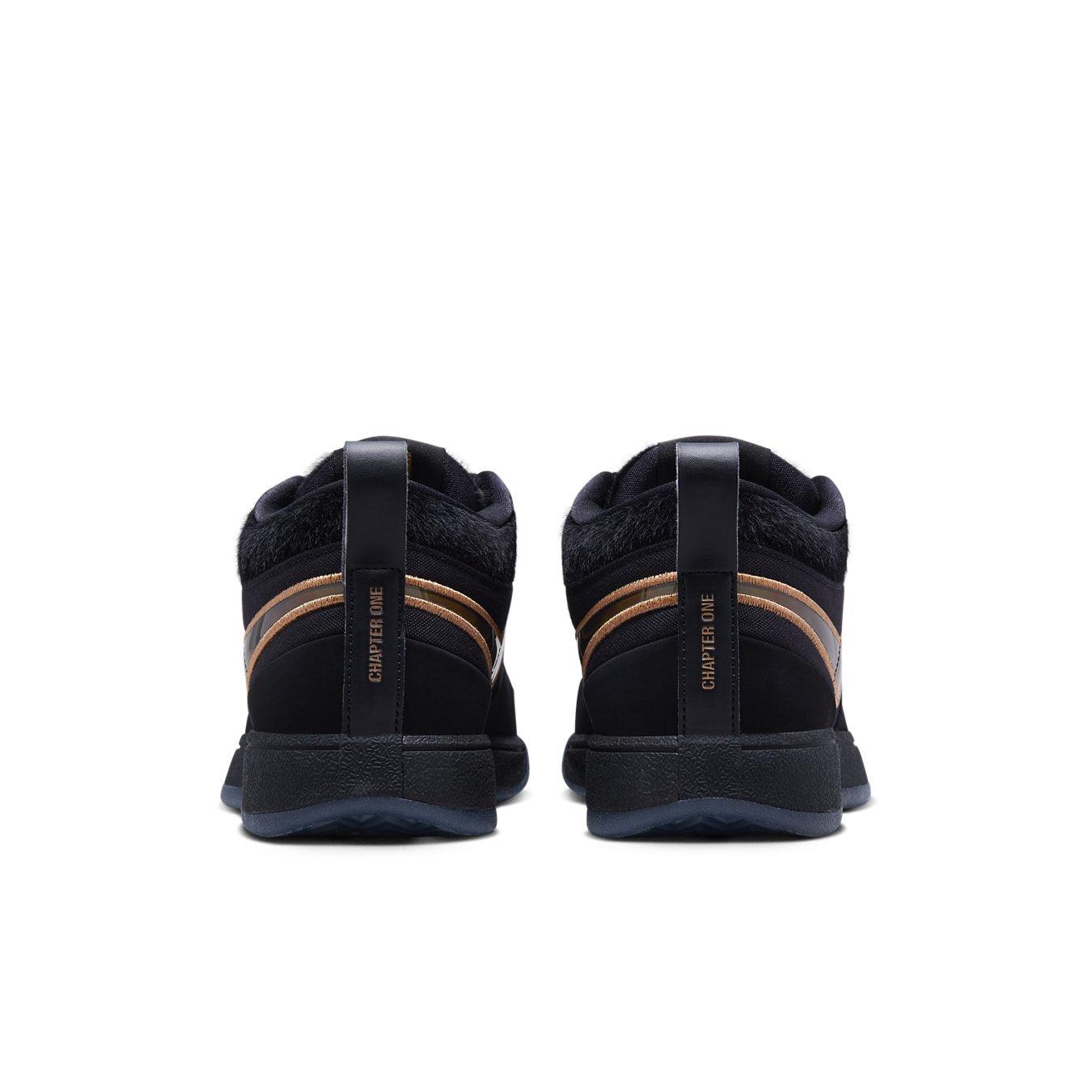 Rear view of Nike Book 1 Haven sneakers featuring black suede and bronze Swoosh, emphasizing 'Chapter One' branding.