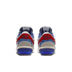 Nike Cortez 4.0 Sacai in white, university red, and blue, showcasing the back view with co-branding details.