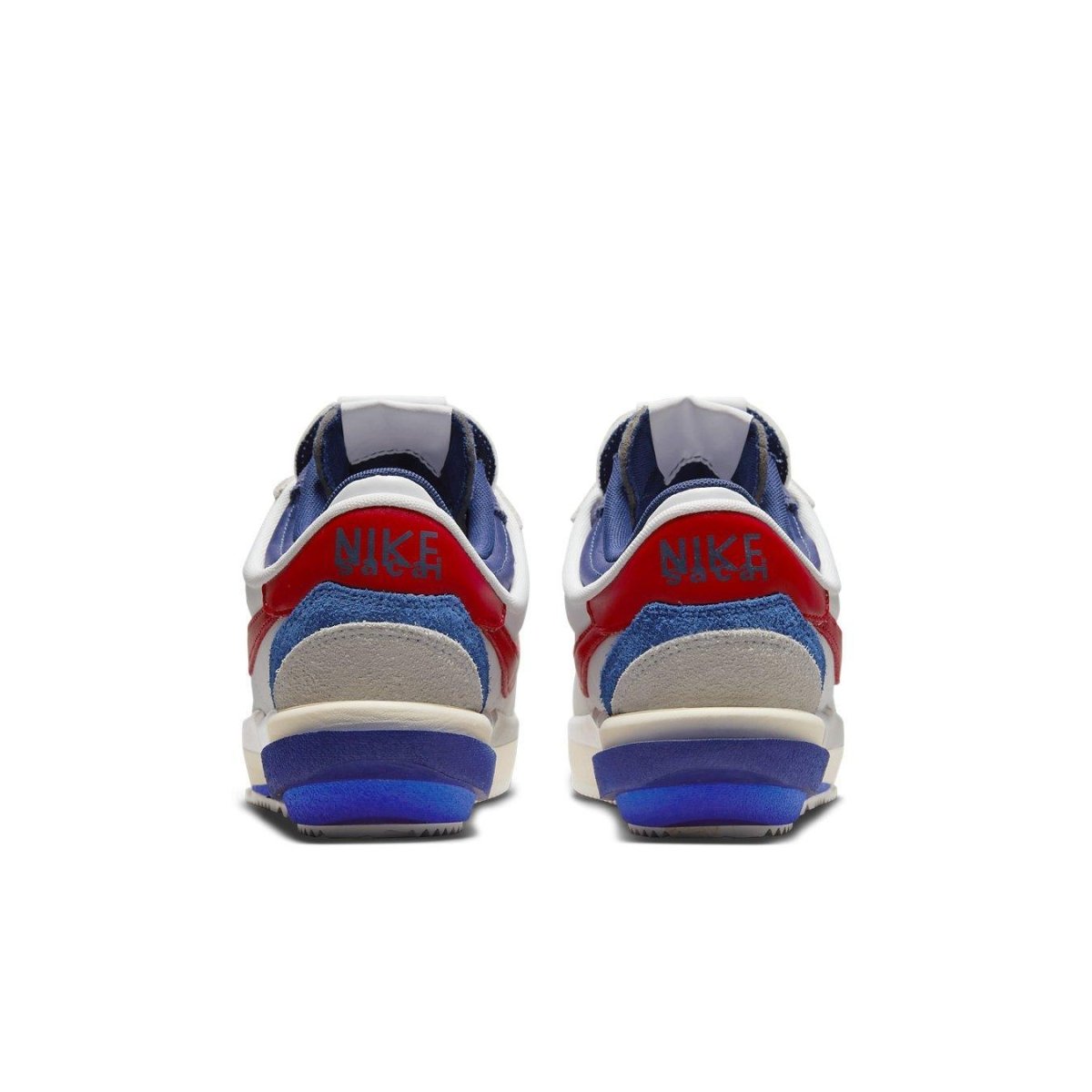 Nike Cortez 4.0 Sacai in white, university red, and blue, showcasing the back view with co-branding details.