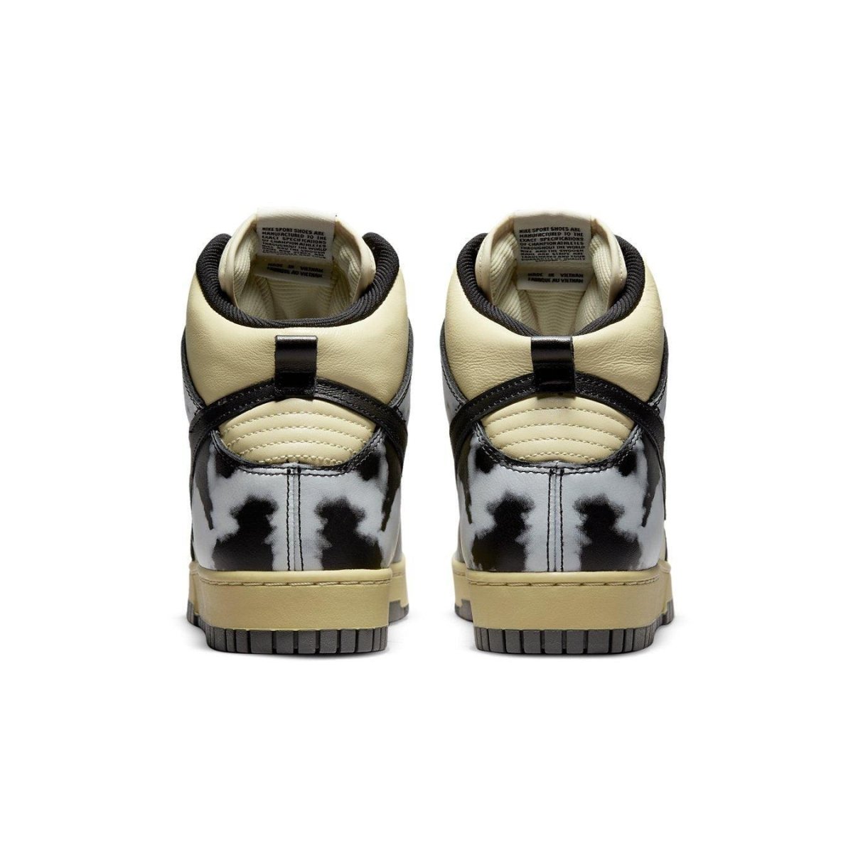 Nike Dunk High 1985 in black and cream with cow print design, showcasing the back view of the sneaker.