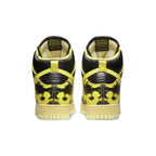Nike Dunk High 1985 SP Yellow Acid Wash sneakers, back view showing black and yellow design.