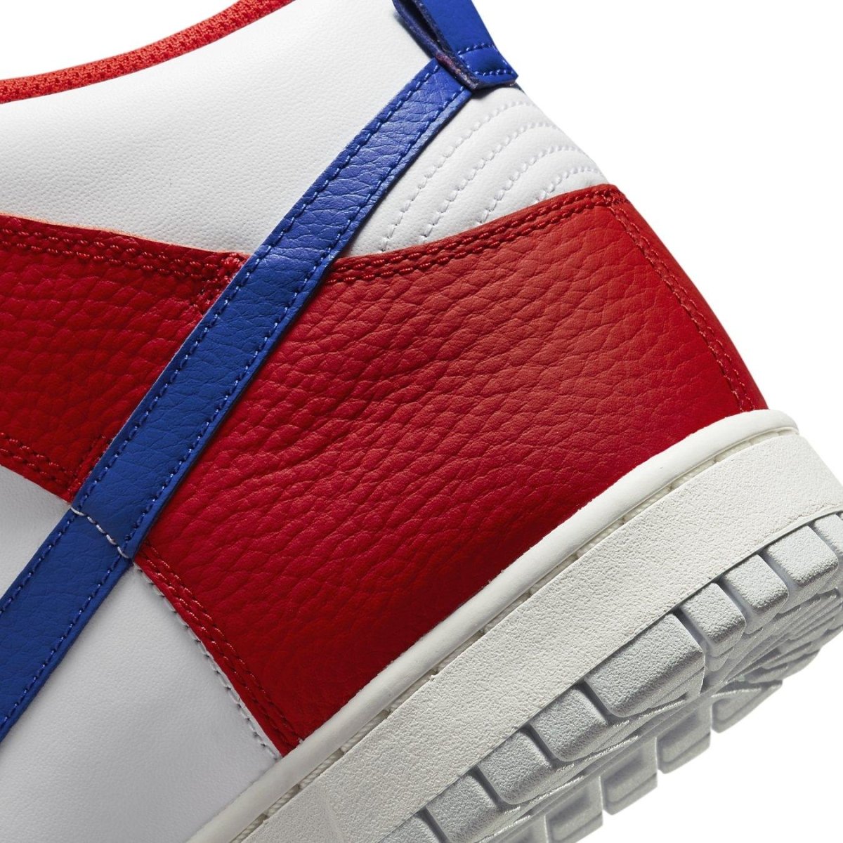 Close-up of Nike Dunk High 4th of July 2022 featuring red, white, and blue leather detailing.
