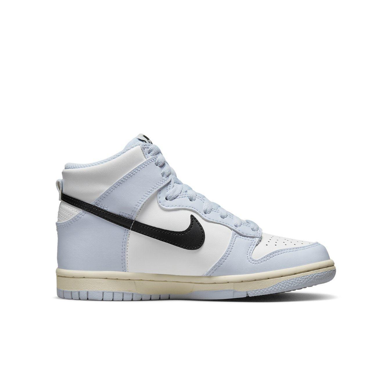 Nike Dunk High Aluminum (GS) shoes featuring a high-top silhouette in light blue and white with black Swoosh and vintage-style sole.