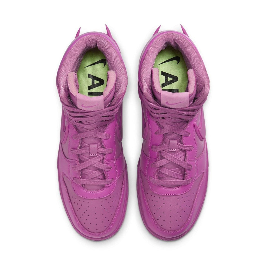 Nike Dunk High Ambush in Cosmic Fuchsia, featuring a vibrant pink leather upper and high tongue design.