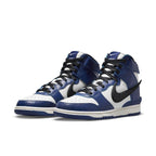 Nike Dunk High AMBUSH Deep Royal sneakers with blue and white leather design, featuring a black Swoosh and stylish silhouette.