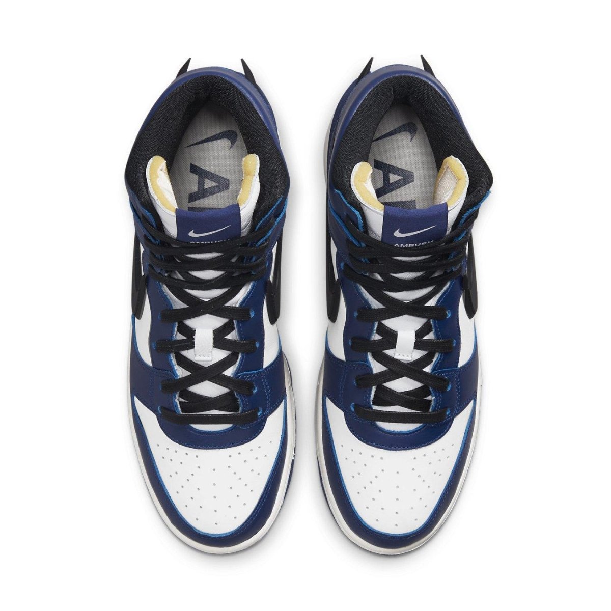 Top view of Nike Dunk High AMBUSH Deep Royal featuring white leather and blue overlays with a bold black Swoosh.