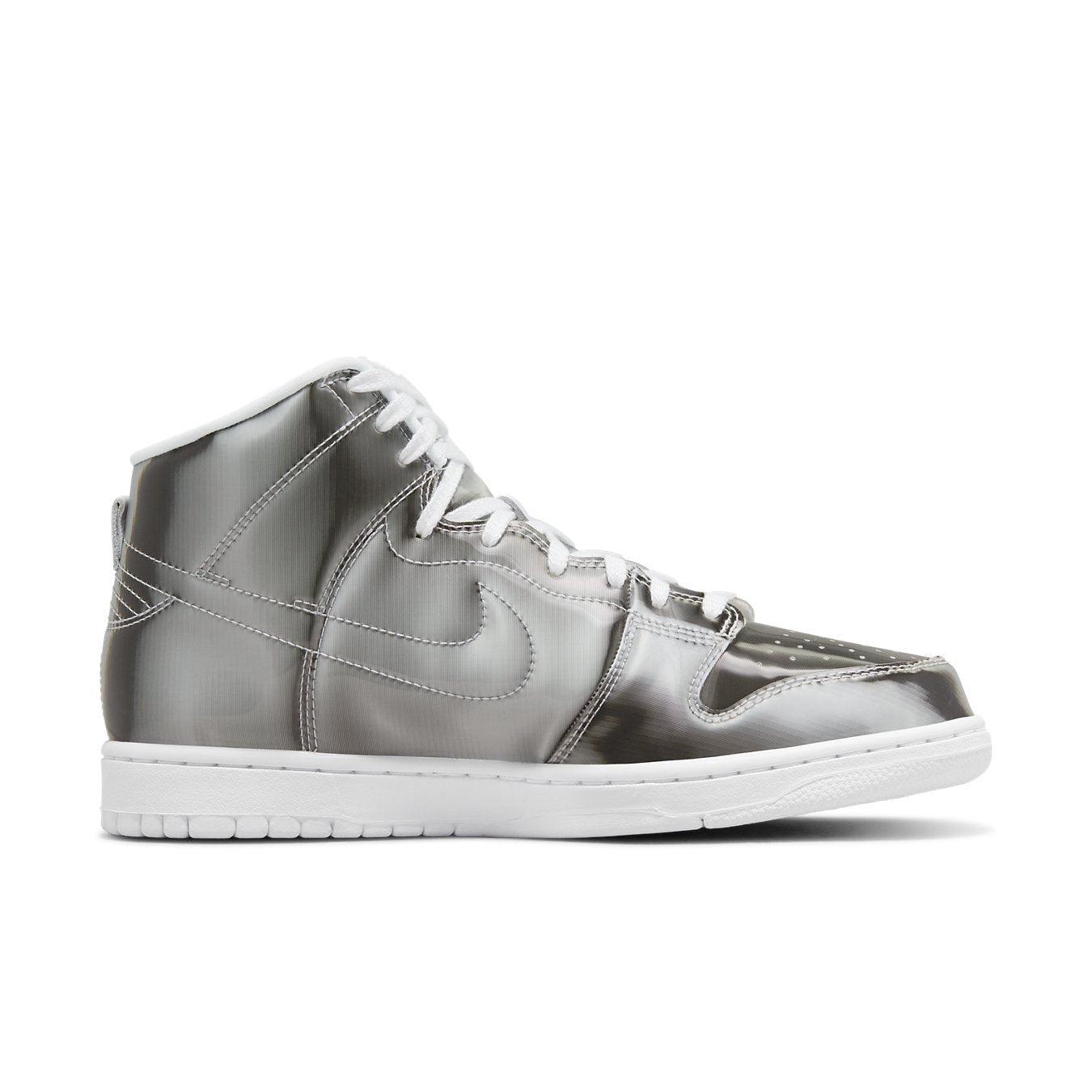 Nike Dunk High CLOT Flux sneakers in metallic silver with white laces and sole, showcasing innovative streetwear design.