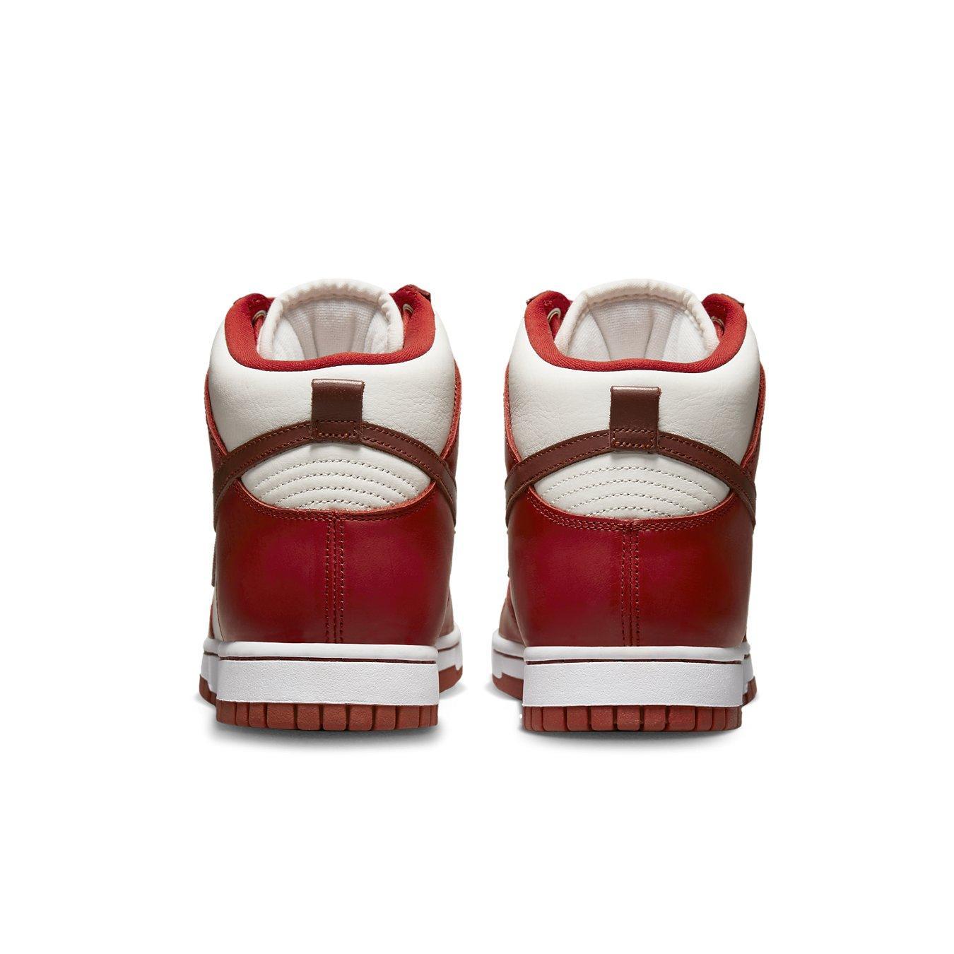Nike Dunk High LXX Cinnabar women’s sneakers, rear view showcasing red and white color scheme with stylish design.