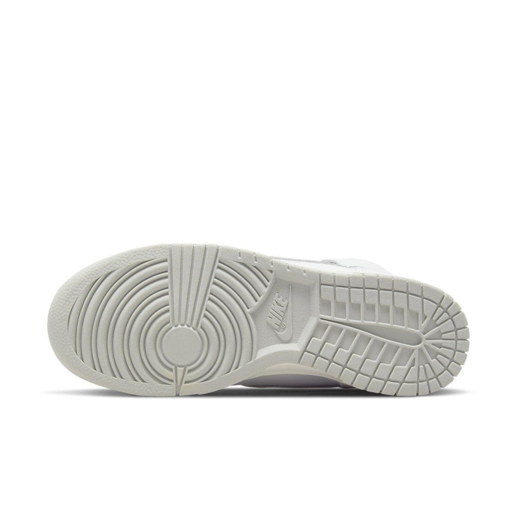 Sole view of the Nike Dunk High Neutral Grey Women's sneaker, showcasing its clean white outsole design.