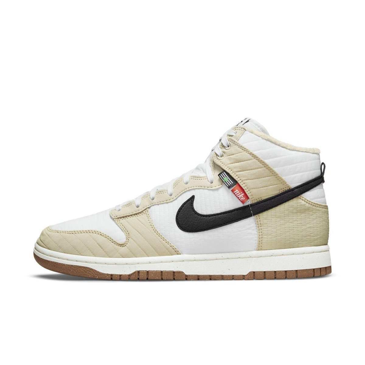 Nike Dunk High Next Nature Toasty Rattan sneaker in beige and black with quilted details for winter outdoor wear.